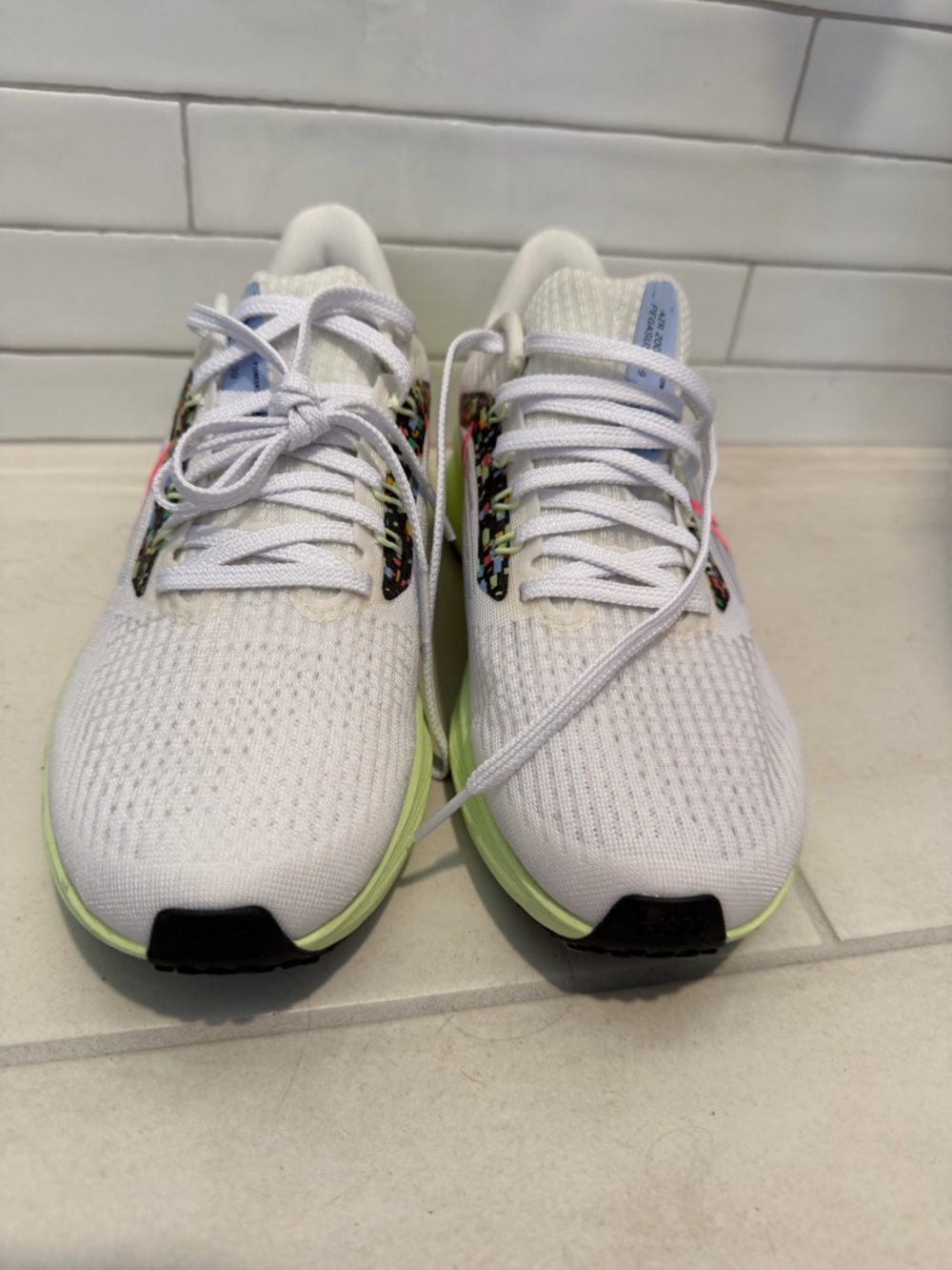 Nike White Sneakers with Multicolor Pattern and Red Stripe